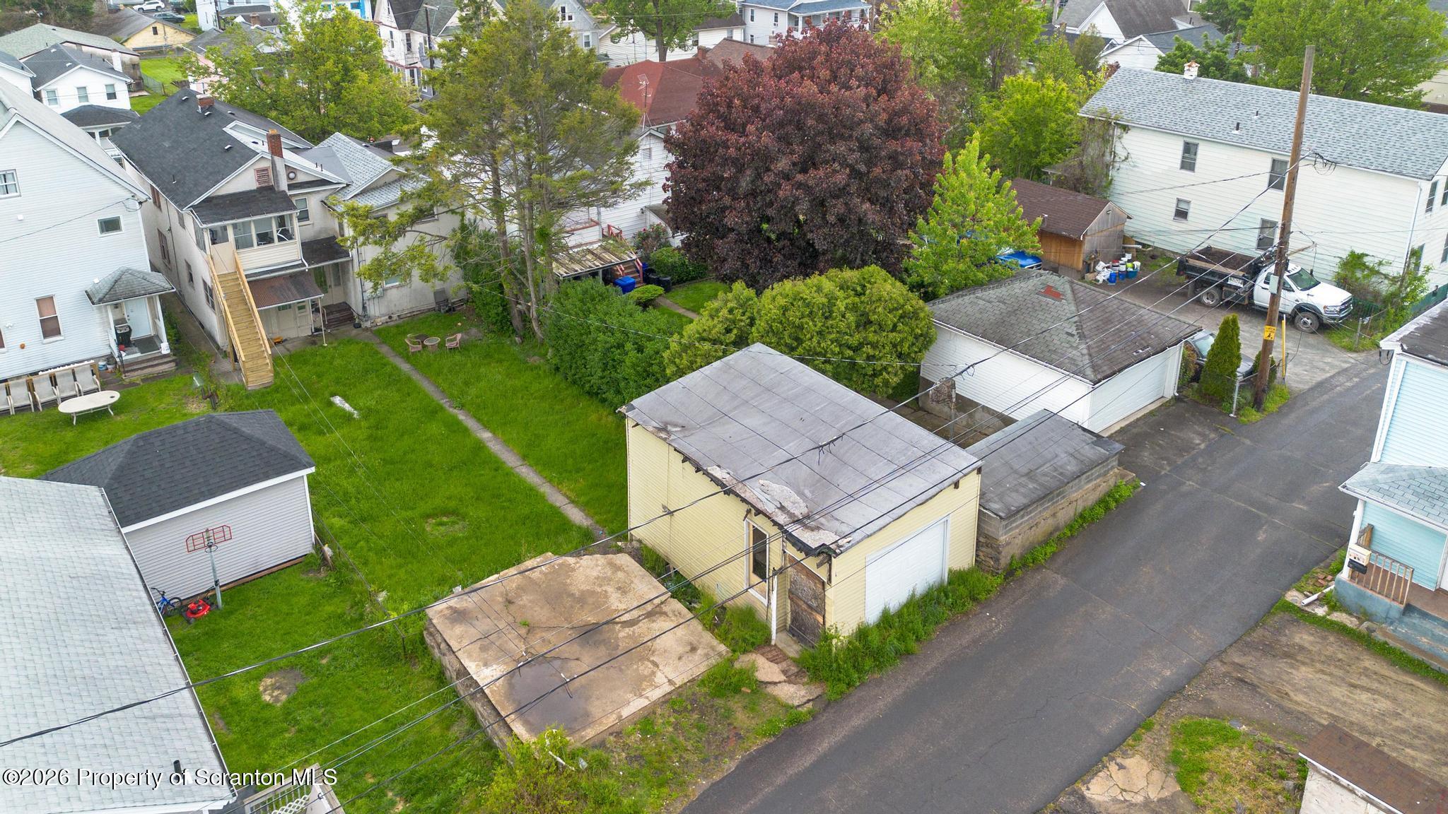 433 Willow Street Scranton, PA 18505 - Photo 54 of 61 an aerial view of a house with a garden and a yard