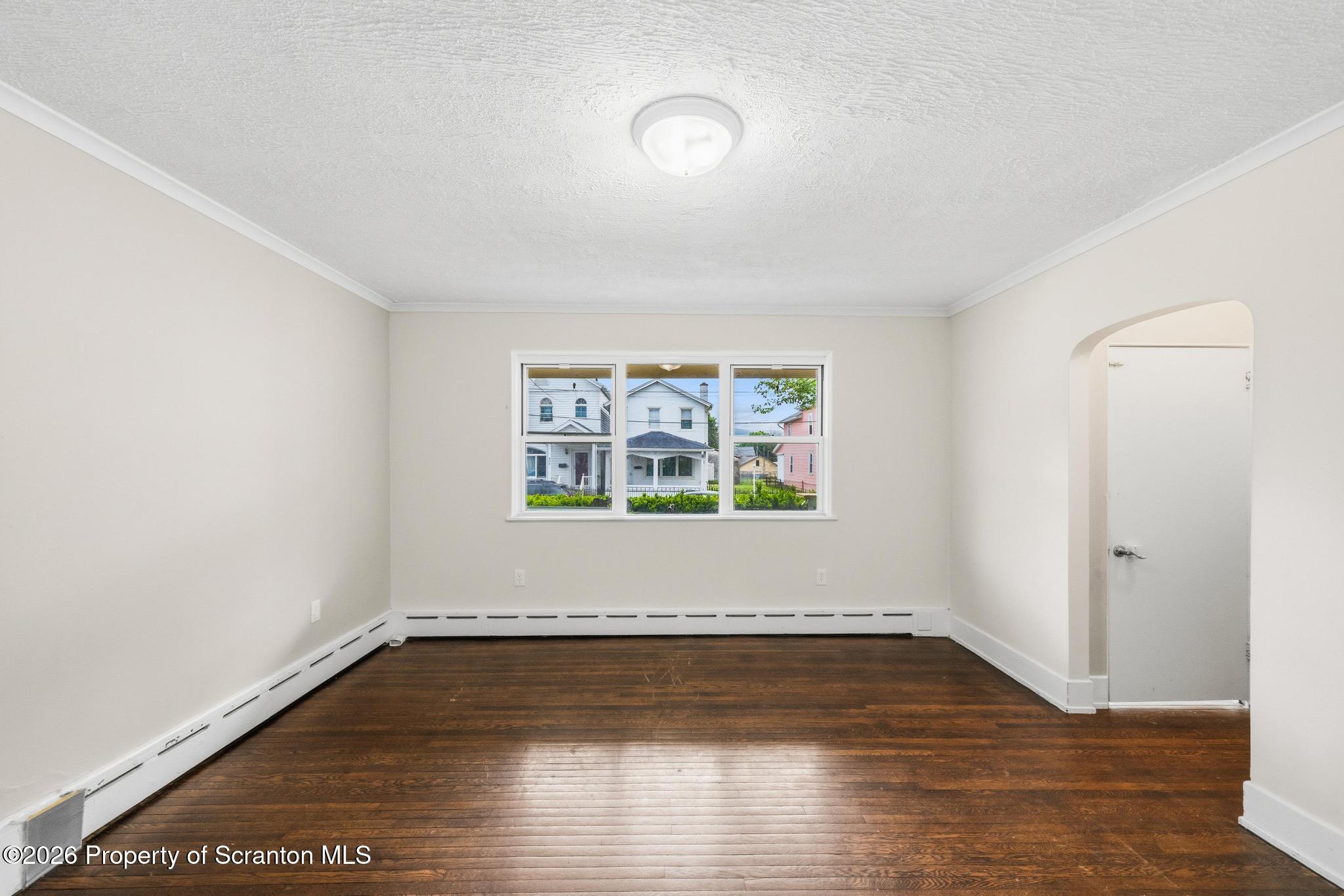 433 Willow Street Scranton, PA 18505 - Photo 7 of 61 a view of a room with wooden floor and window