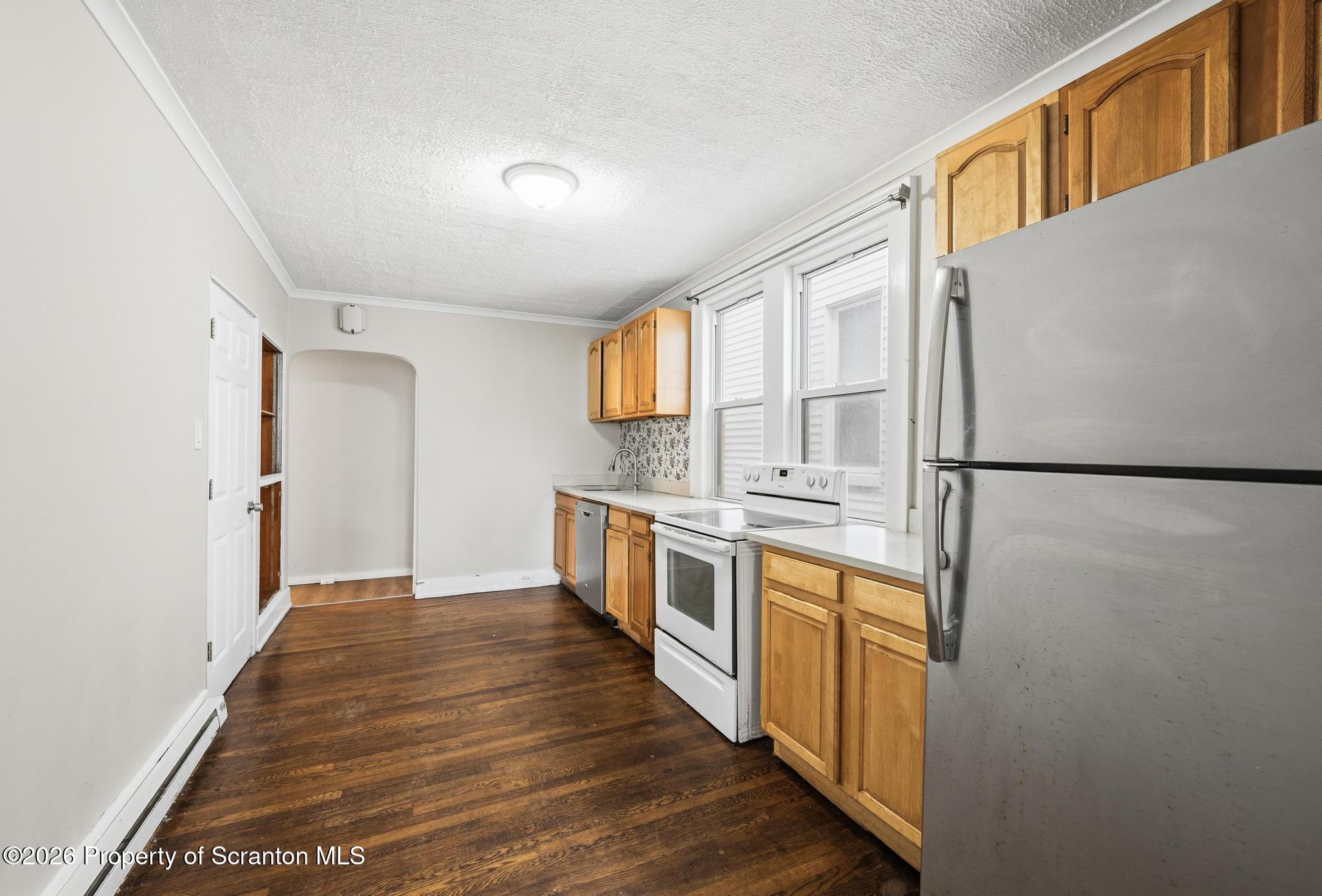 433 Willow Street Scranton, PA 18505 - Photo 10 of 61 a kitchen with stainless steel appliances granite countertop a refrigerator a stove and a sink