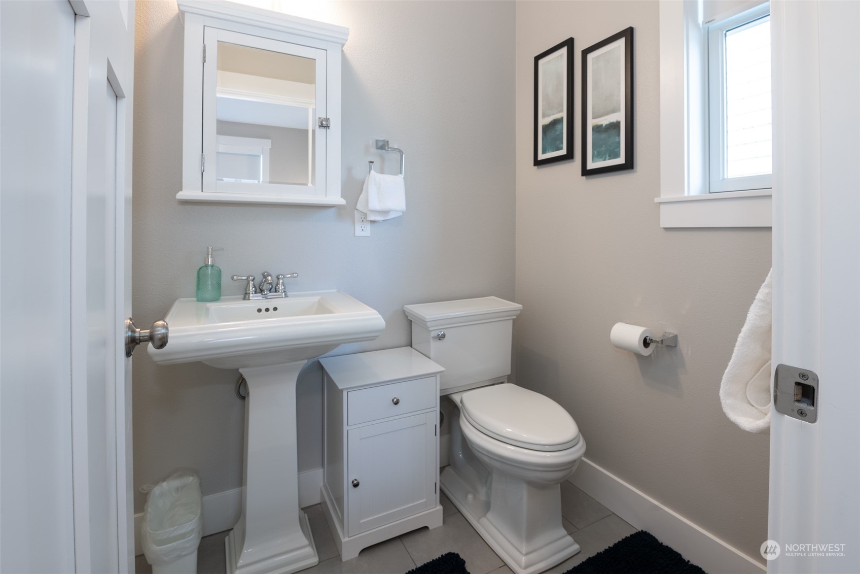 16 Barnhill Loop Pacific Beach, WA 98571 - Photo 12 of 31 a bathroom with a sink toilet and a mirror