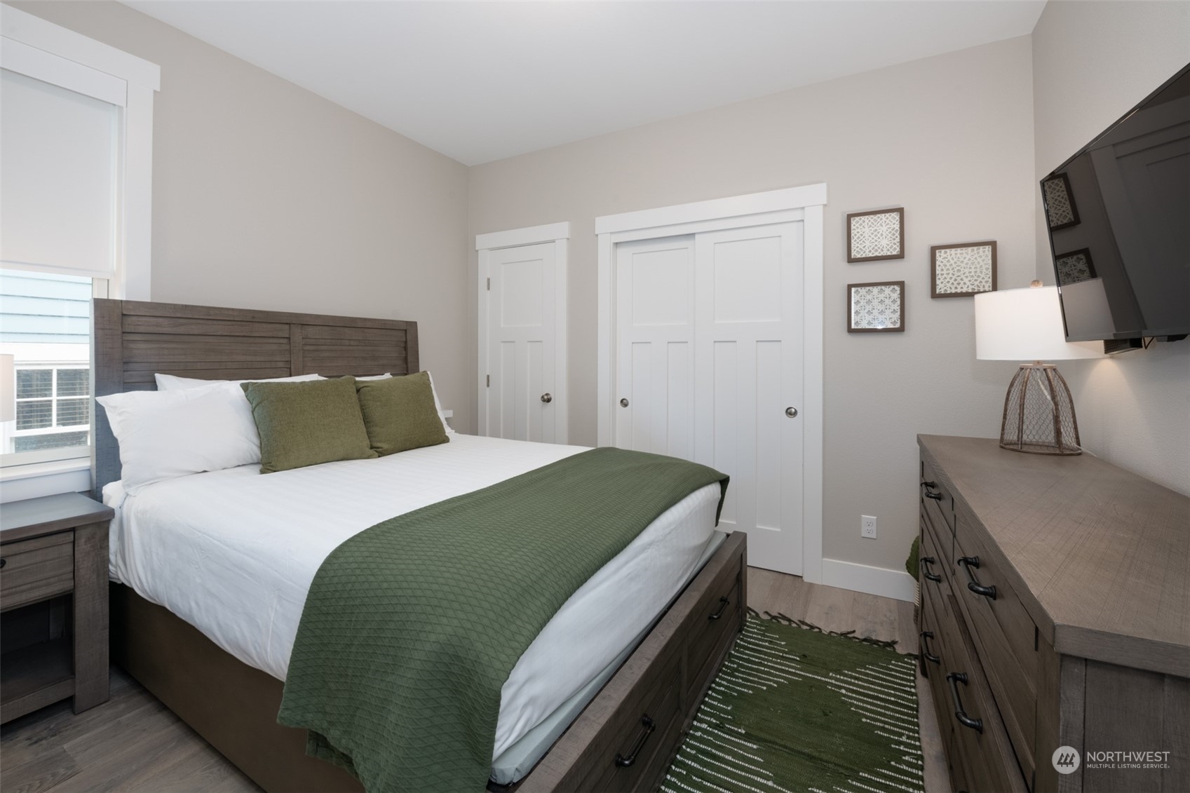 16 Barnhill Loop Pacific Beach, WA 98571 - Photo 17 of 31 a bedroom with a bed and a flat screen tv