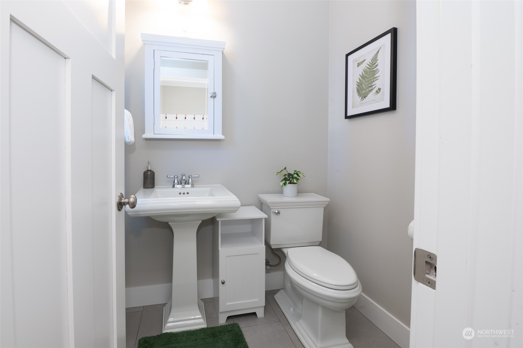 16 Barnhill Loop Pacific Beach, WA 98571 - Photo 20 of 31 a white toilet sitting next to a bathroom sink