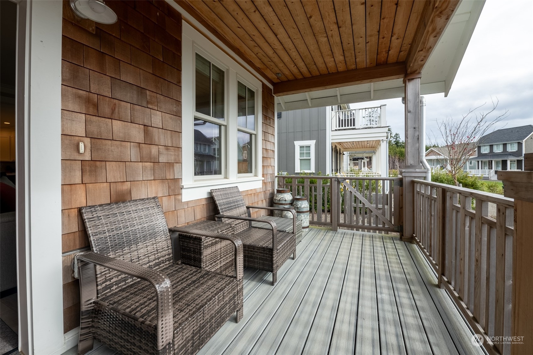 16 Barnhill Loop Pacific Beach, WA 98571 - Photo 2 of 31 a balcony of a house with wooden floor outdoor seating and wooden floor