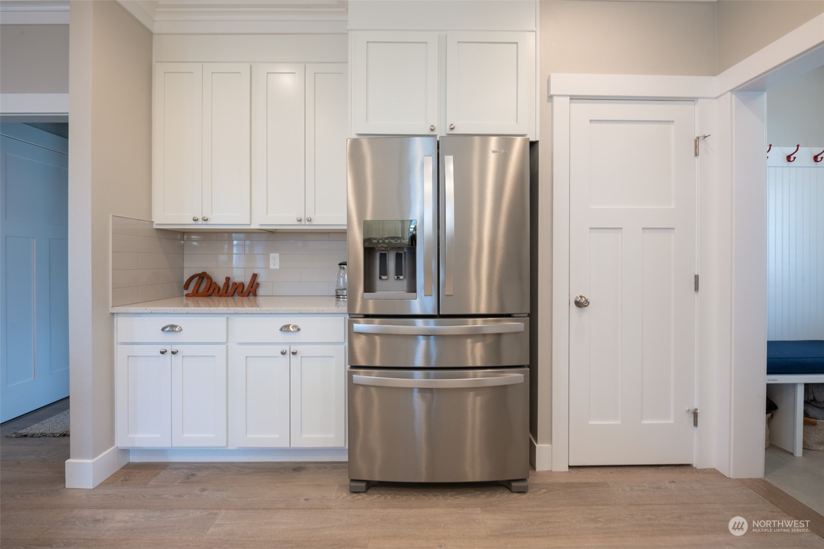 16 Barnhill Loop Pacific Beach, WA 98571 - Photo 22 of 31 a kitchen with stainless steel appliances white cabinets and a refrigerator
