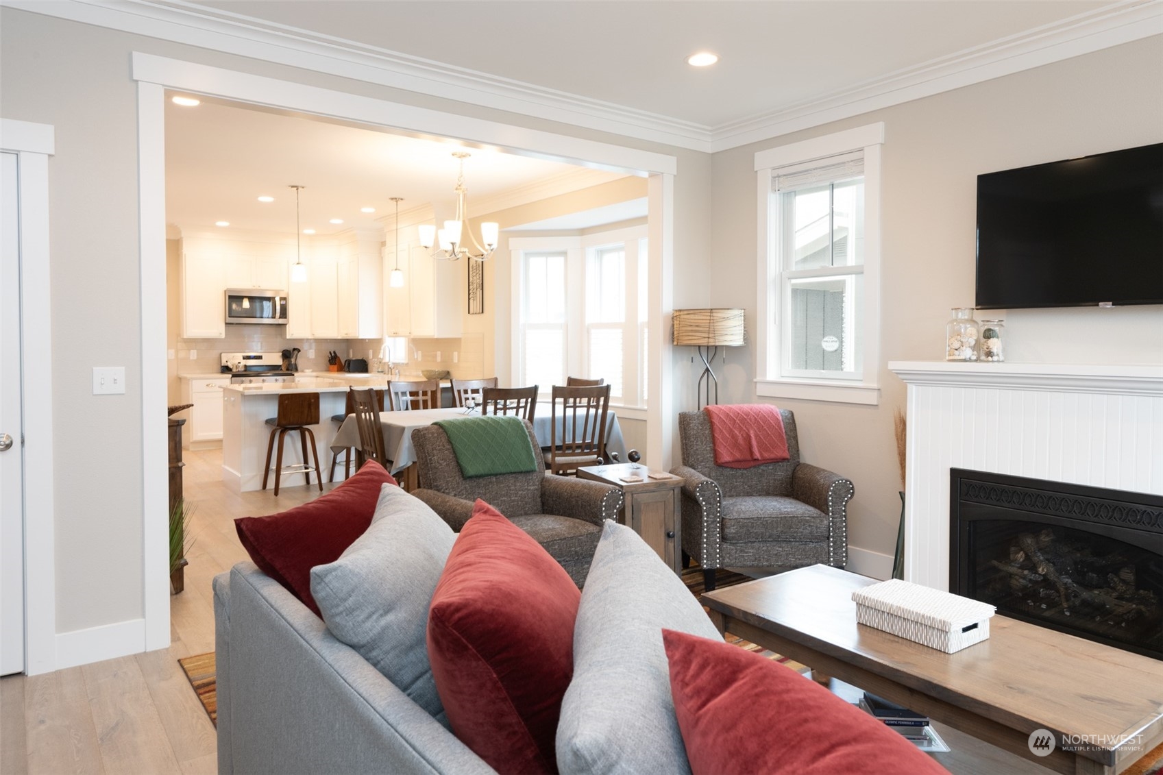 16 Barnhill Loop Pacific Beach, WA 98571 - Photo 4 of 31 a living room with furniture a flat screen tv and a fireplace