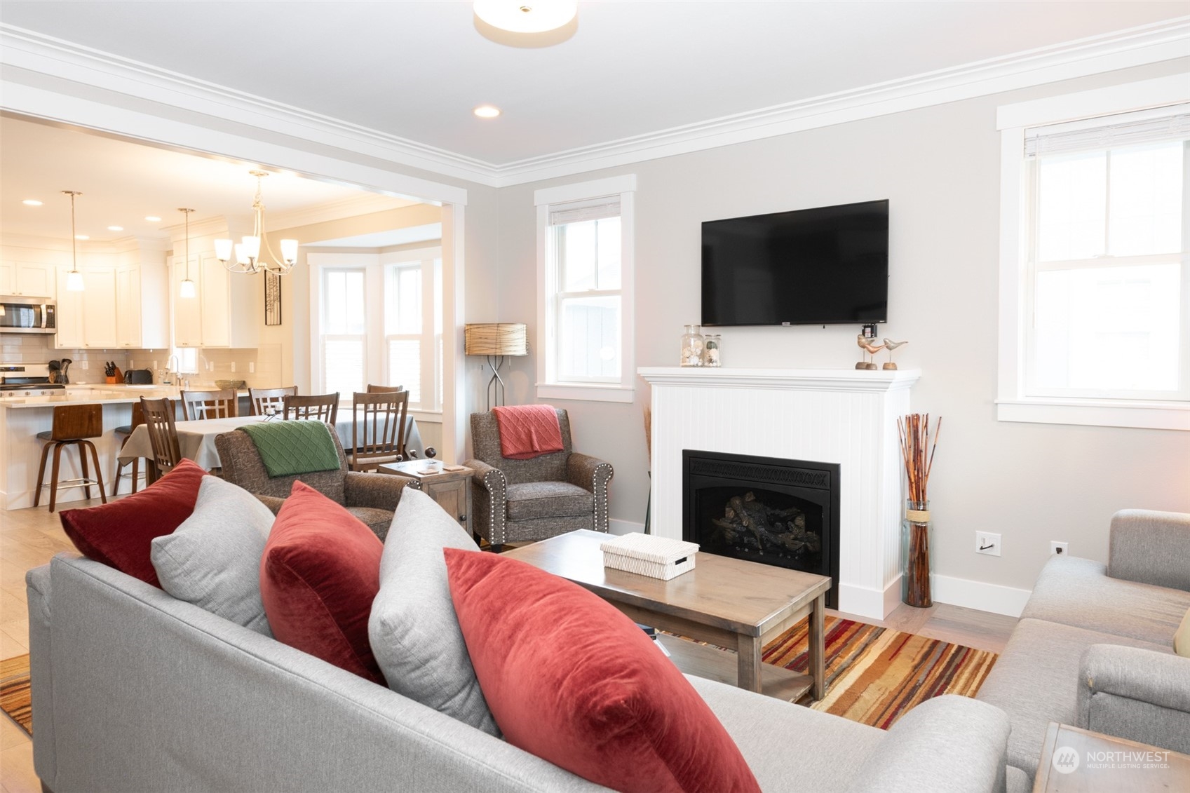16 Barnhill Loop Pacific Beach, WA 98571 - Photo 5 of 31 a living room with furniture a flat screen tv and a fireplace