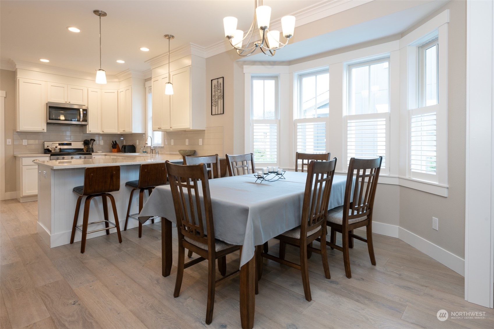 16 Barnhill Loop Pacific Beach, WA 98571 - Photo 6 of 31 a view of a dining room with furniture window and wooden floor
