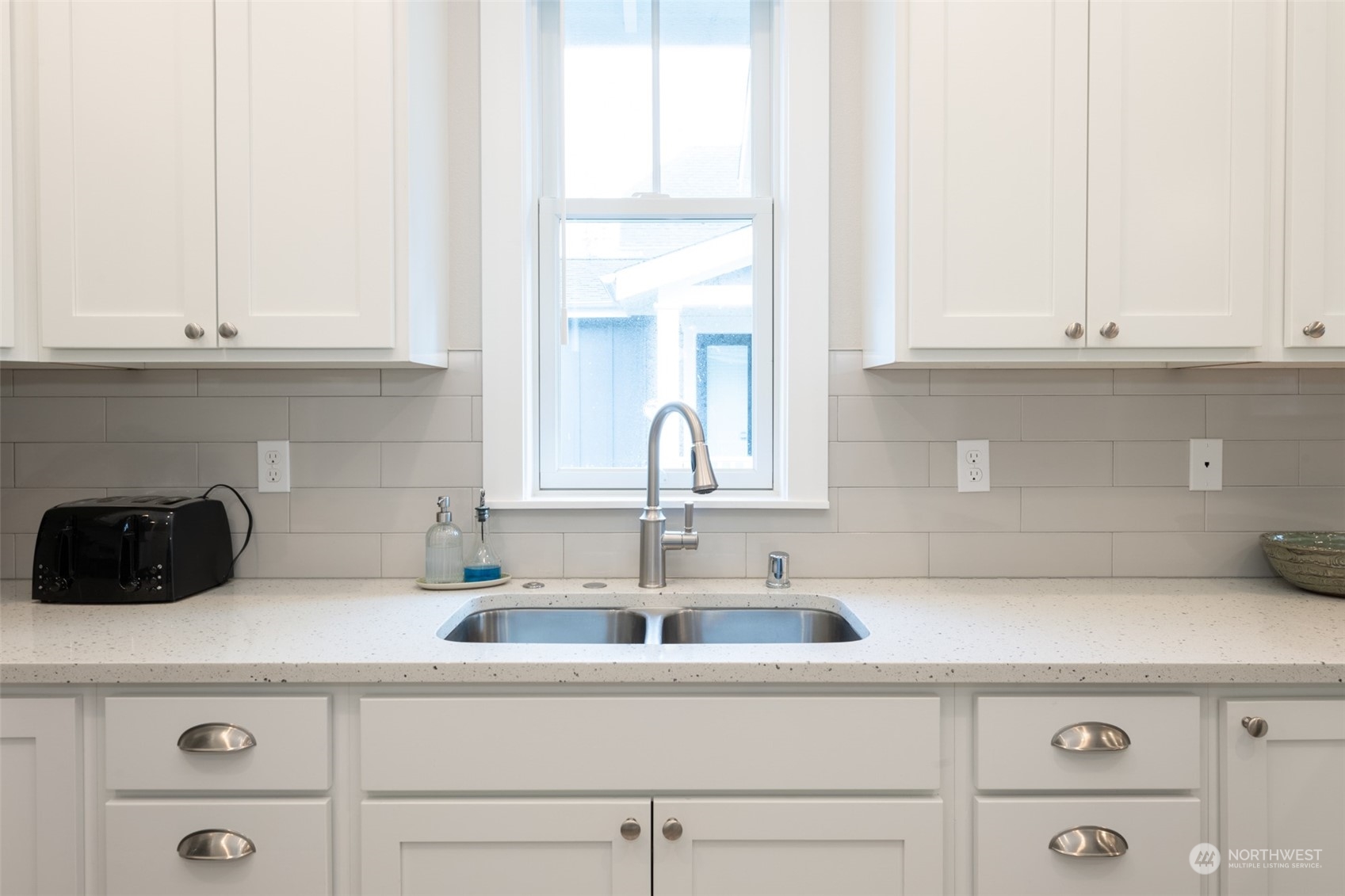 16 Barnhill Loop Pacific Beach, WA 98571 - Photo 9 of 31 a kitchen with a sink and cabinets