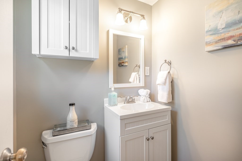82 Wyman Road Billerica, MA 01821 - Photo 14 of 28 a bathroom with a sink vanity and a toilet