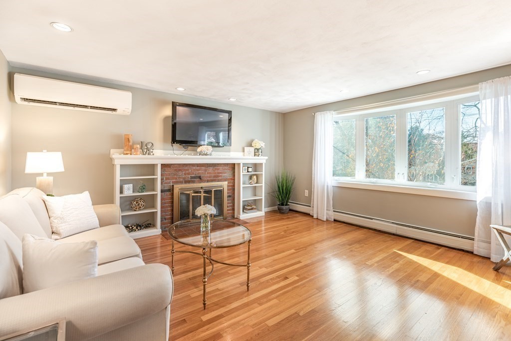 82 Wyman Road Billerica, MA 01821 - Photo 5 of 28 a living room with furniture and a large window
