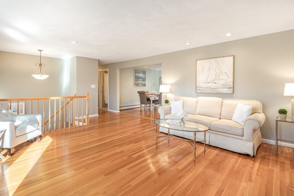 82 Wyman Road Billerica, MA 01821 - Photo 6 of 28 a living room with furniture and a wooden floor
