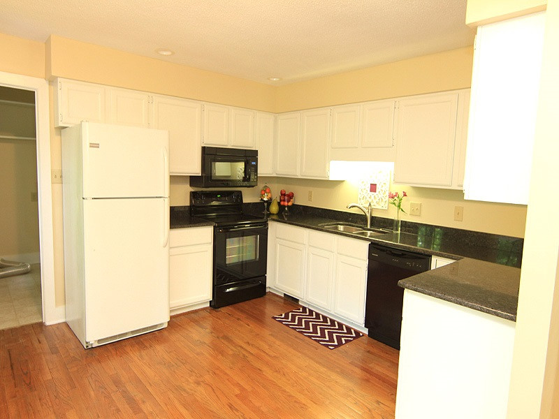 9 Strawberry Ridge Lane Durham, NC 27713 - Photo 7 of 17 Gleaming hardwood floors, granite counters, updated appliances and freshly painted cabinets. Large laundry room located off of the kitchen. Kitchen