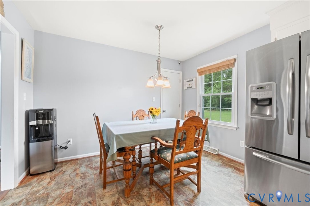 3279 Broad St Road Gum Spring, VA 23065 - Photo 13 of 48 a dining room with furniture and window