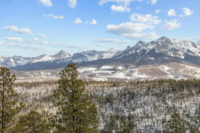 a view of a city with a building in the background
