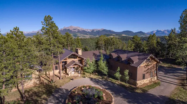 a view of a house with a tree