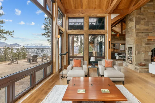 a view of a patio with a table chairs and a floor to ceiling window