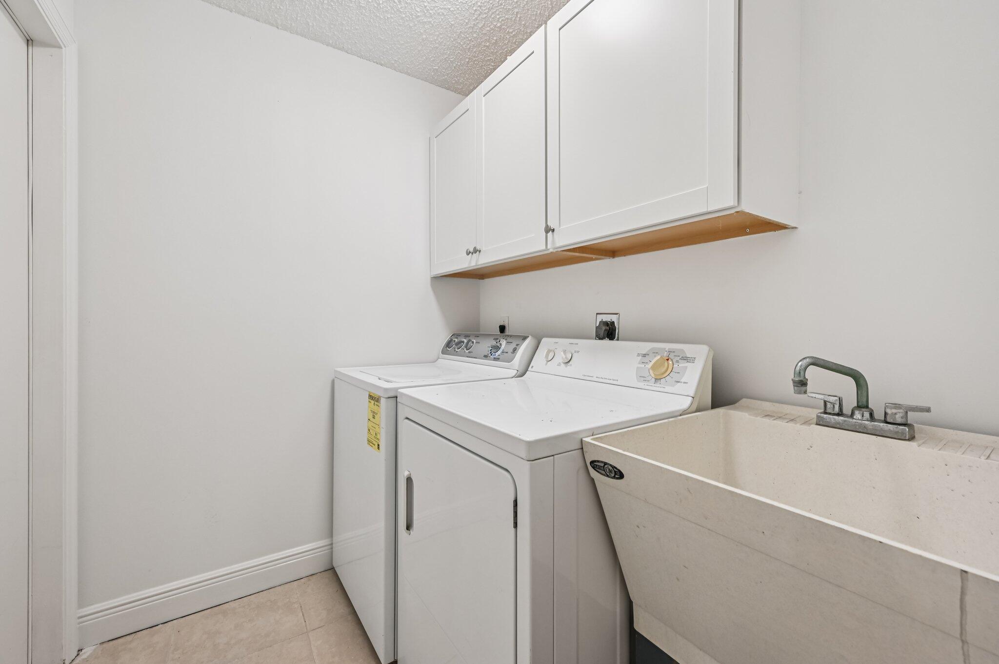 7184 Southeast Magellan Lane Stuart, FL 34997 - Photo 20 of 34 a utility room with dryer and washer