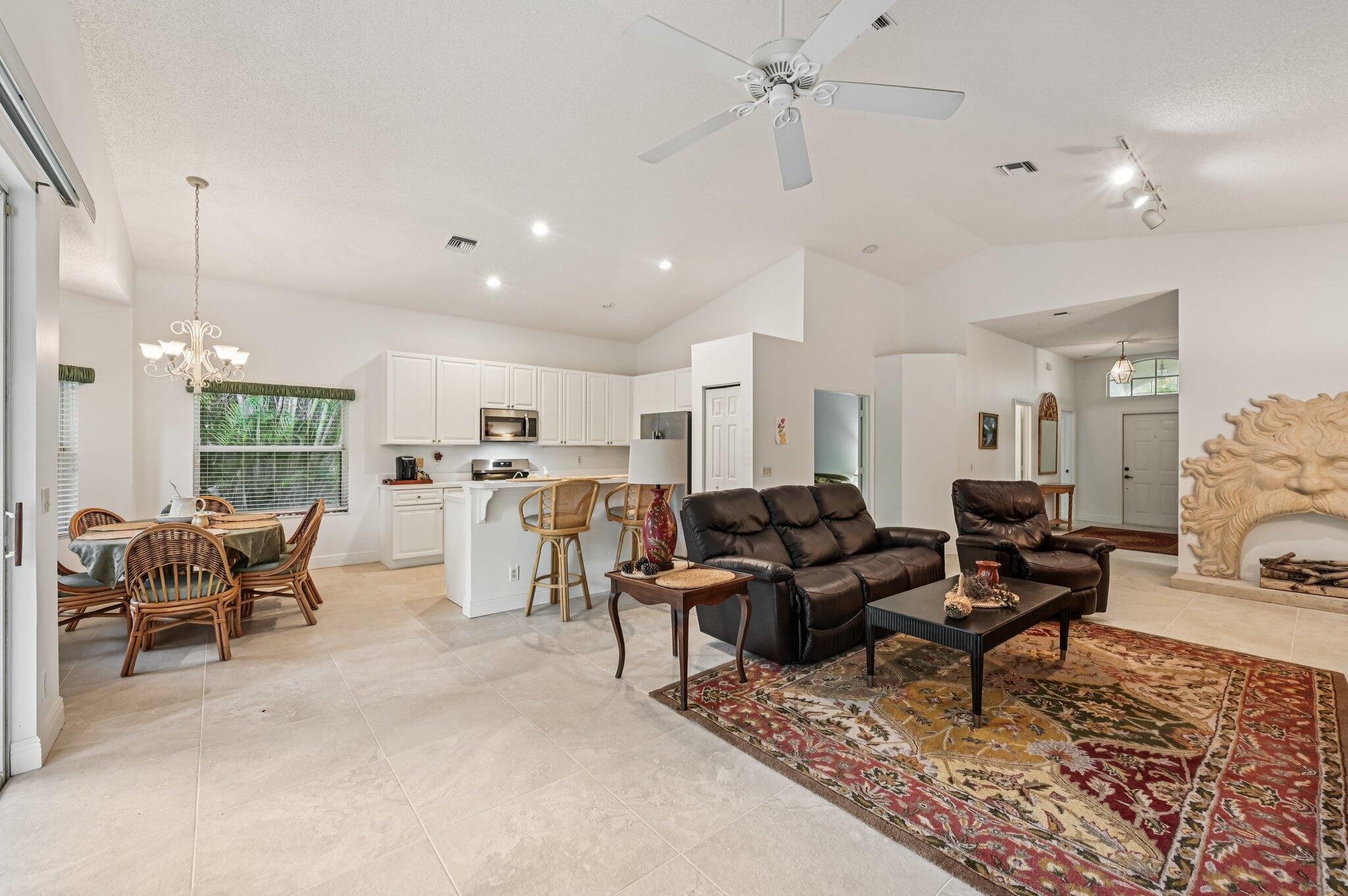 7184 Southeast Magellan Lane Stuart, FL 34997 - Photo 10 of 34 a living room with furniture and a large window