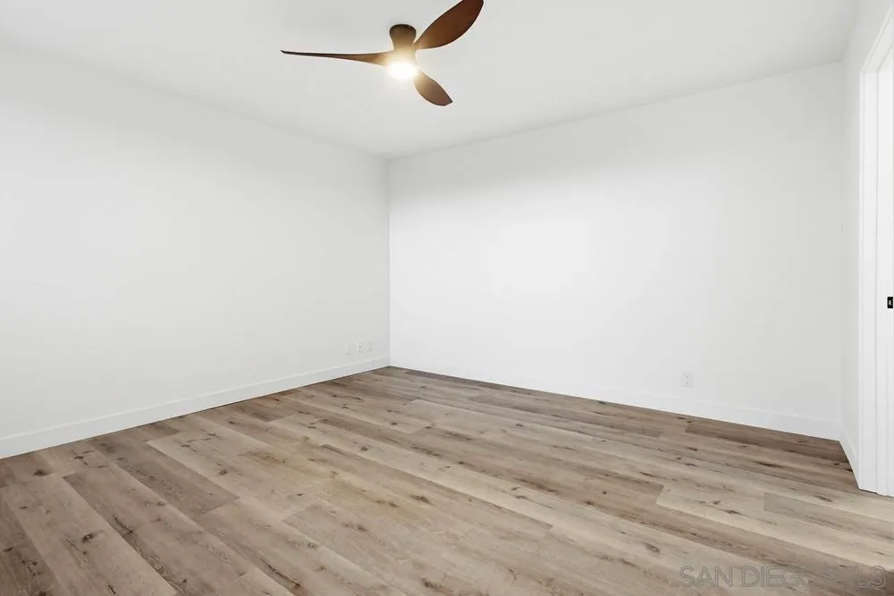 4379 Albatross Way Oceanside, CA 92057 - Photo 18 of 44 a view of empty room with wooden floor