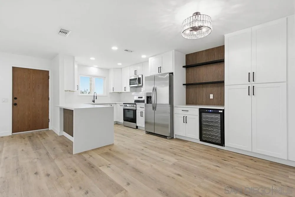4379 Albatross Way Oceanside, CA 92057 - Photo 2 of 44 a kitchen with stainless steel appliances a refrigerator sink and microwave