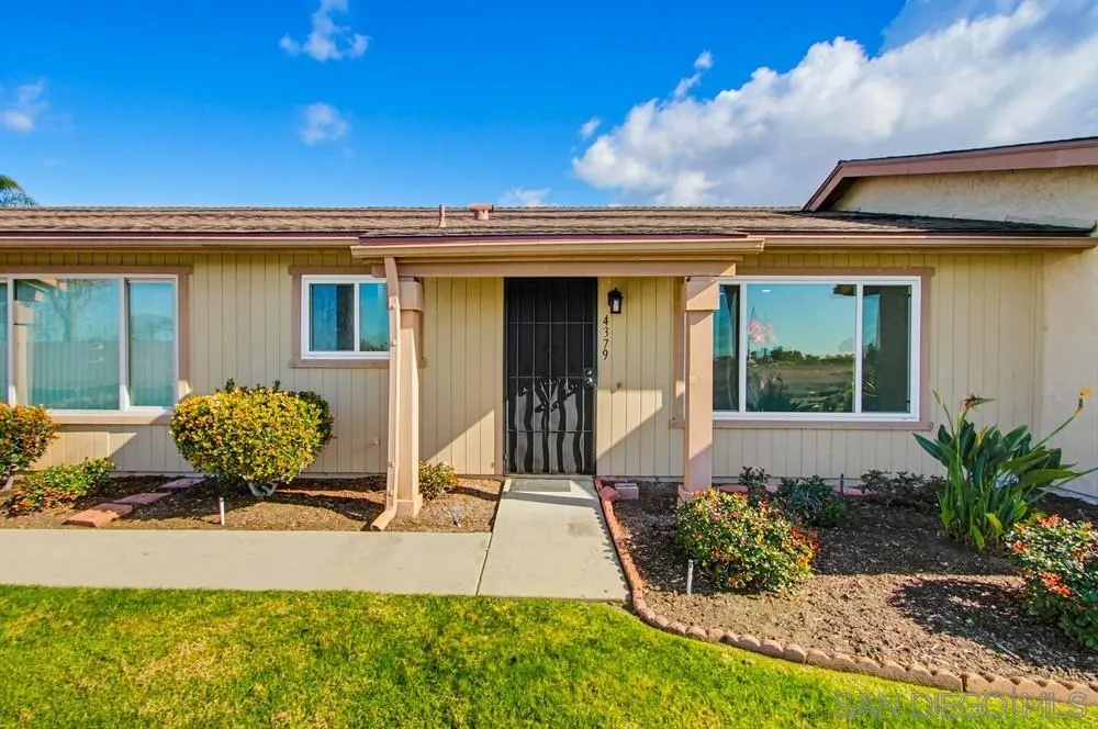 4379 Albatross Way Oceanside, CA 92057 - Photo 43 of 44 a front view of a house with garden