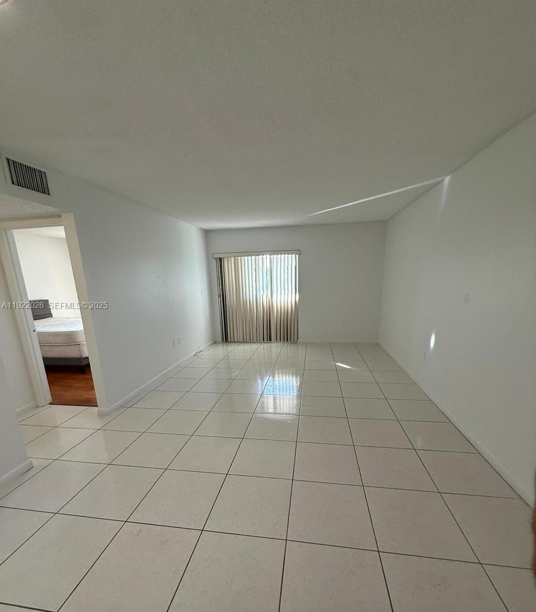 a view of an empty room and window