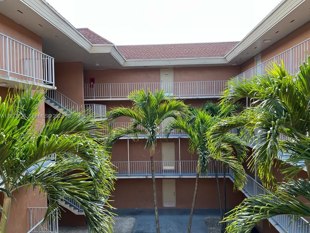 17530 Northwest 68th Avenue, Unit C3010 Hialeah, FL 33015 - Photo 7 of 7 a plant in front of a house