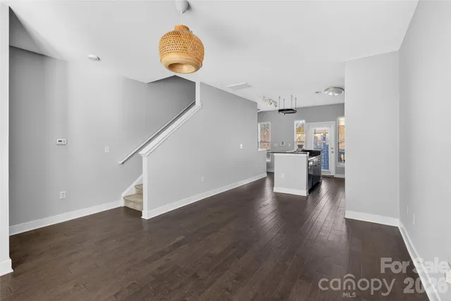 a view of a kitchen cabinets and wooden floor