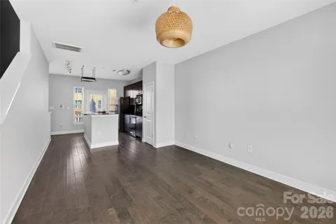 a view of a kitchen with wooden floor