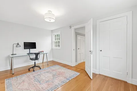 a workspace with furniture and window