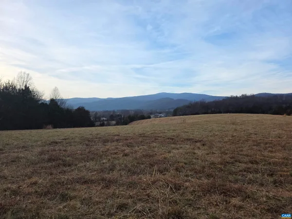 a view of an ocean and mountain