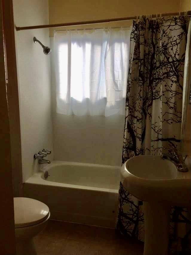 224 Abbott Street Salinas, CA 93901 - Photo 5 of 10 a bathroom with a sink a toilet and a bathtub