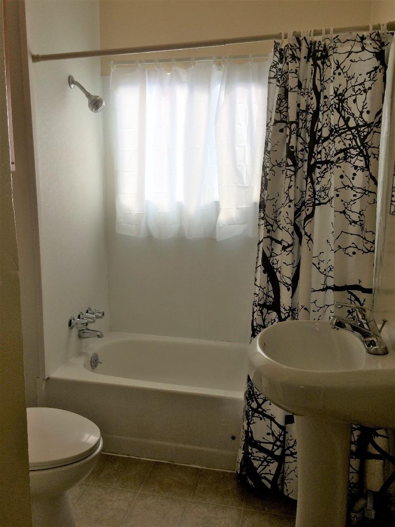 224 Abbott Street Salinas, CA 93901 - Photo 8 of 10 a bathroom with a sink a toilet and shower