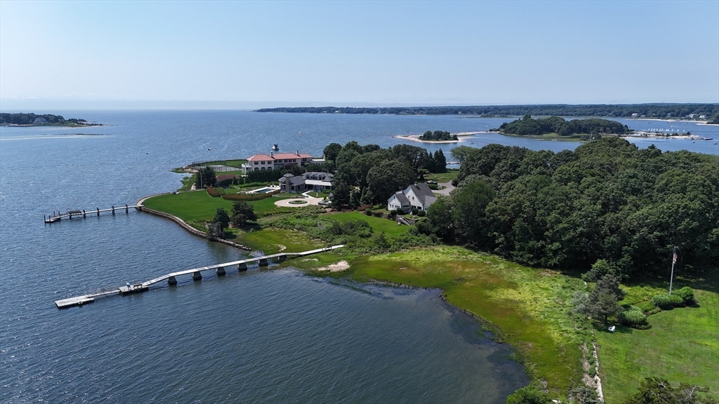 160 Allens Point Road Marion, MA 02738 - Photo 2 of 31 an aerial view of a house with a yard and lake view