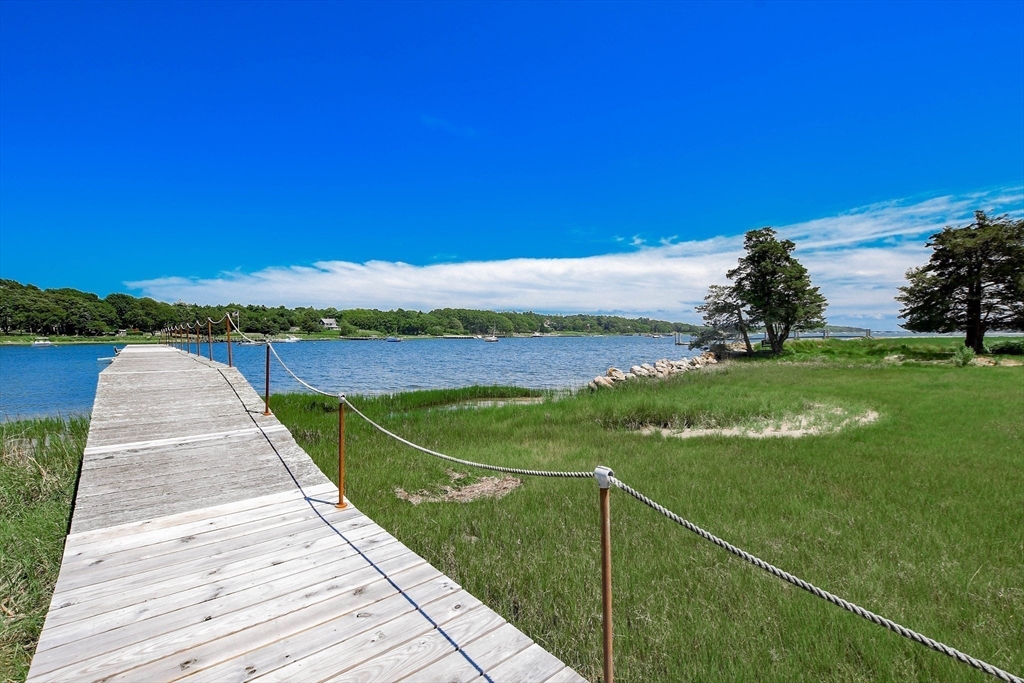 160 Allens Point Road Marion, MA 02738 - Photo 6 of 31 a view of a lake with a big yard
