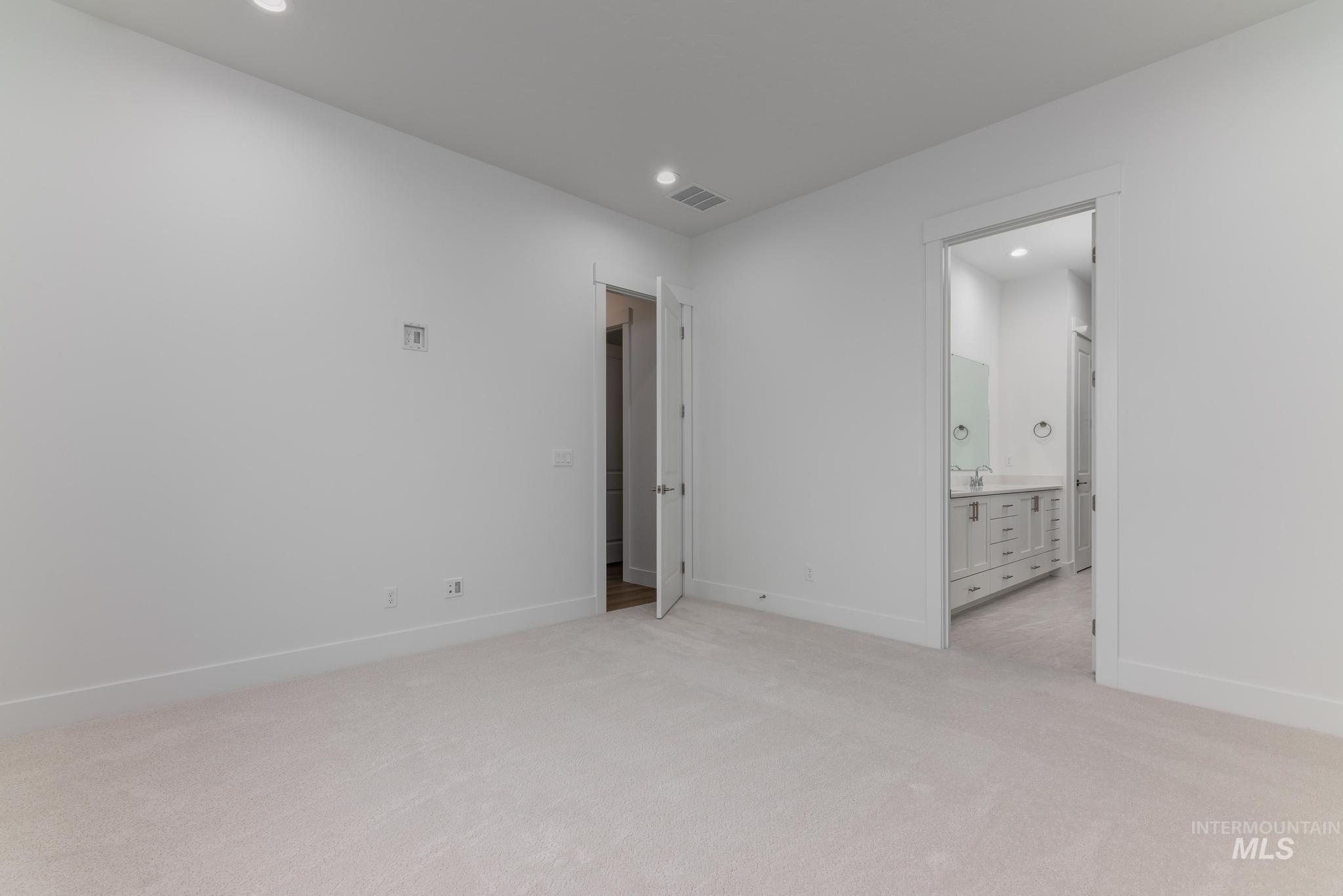 15188 Steel Cloud Avenue Caldwell, ID 83607 - Photo 20 of 34 Unfurnished room with light carpet and recessed lighting