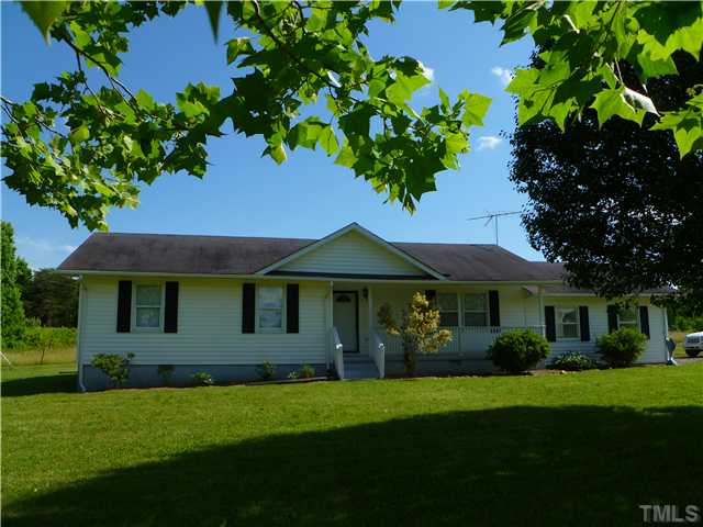 105 Circle B Farm Road Rougemont, NC 27572 - Photo 1 of 22 a front view of a house with a garden