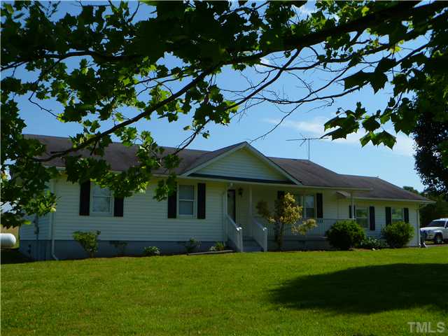 105 Circle B Farm Road Rougemont, NC 27572 - Photo 2 of 22 a front view of a house with a garden