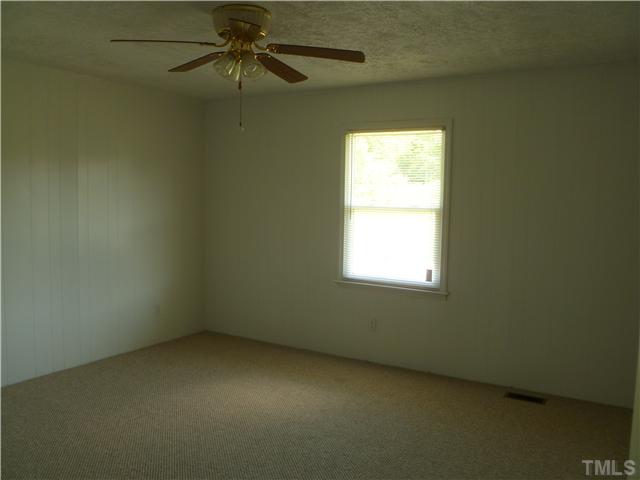 105 Circle B Farm Road Rougemont, NC 27572 - Photo 15 of 22 a view of an empty room with a window