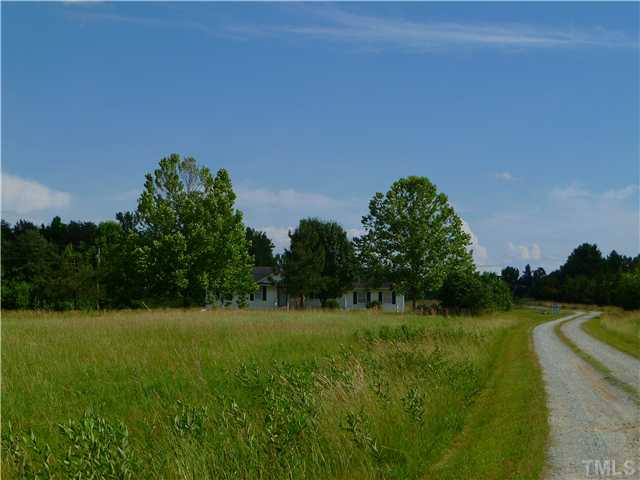 105 Circle B Farm Road Rougemont, NC 27572 - Photo 21 of 22 a view of a golf course with a garden