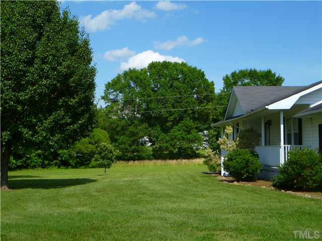 105 Circle B Farm Road Rougemont, NC 27572 - Photo 5 of 22 a view of a house with a backyard