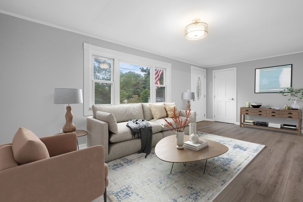 19 Sabbatt Road Pocasset, MA 02559 - Photo 11 of 29 a living room with furniture and a table