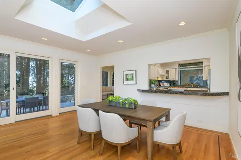 a kitchen with white cabinets and appliances