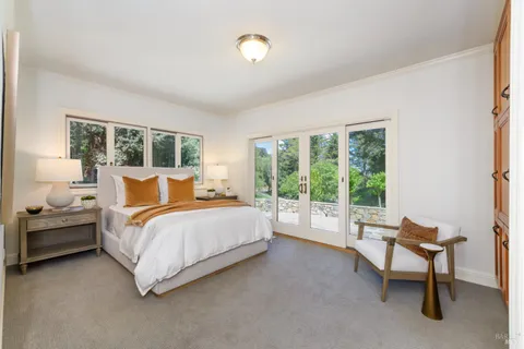 a bedroom with bed and a window