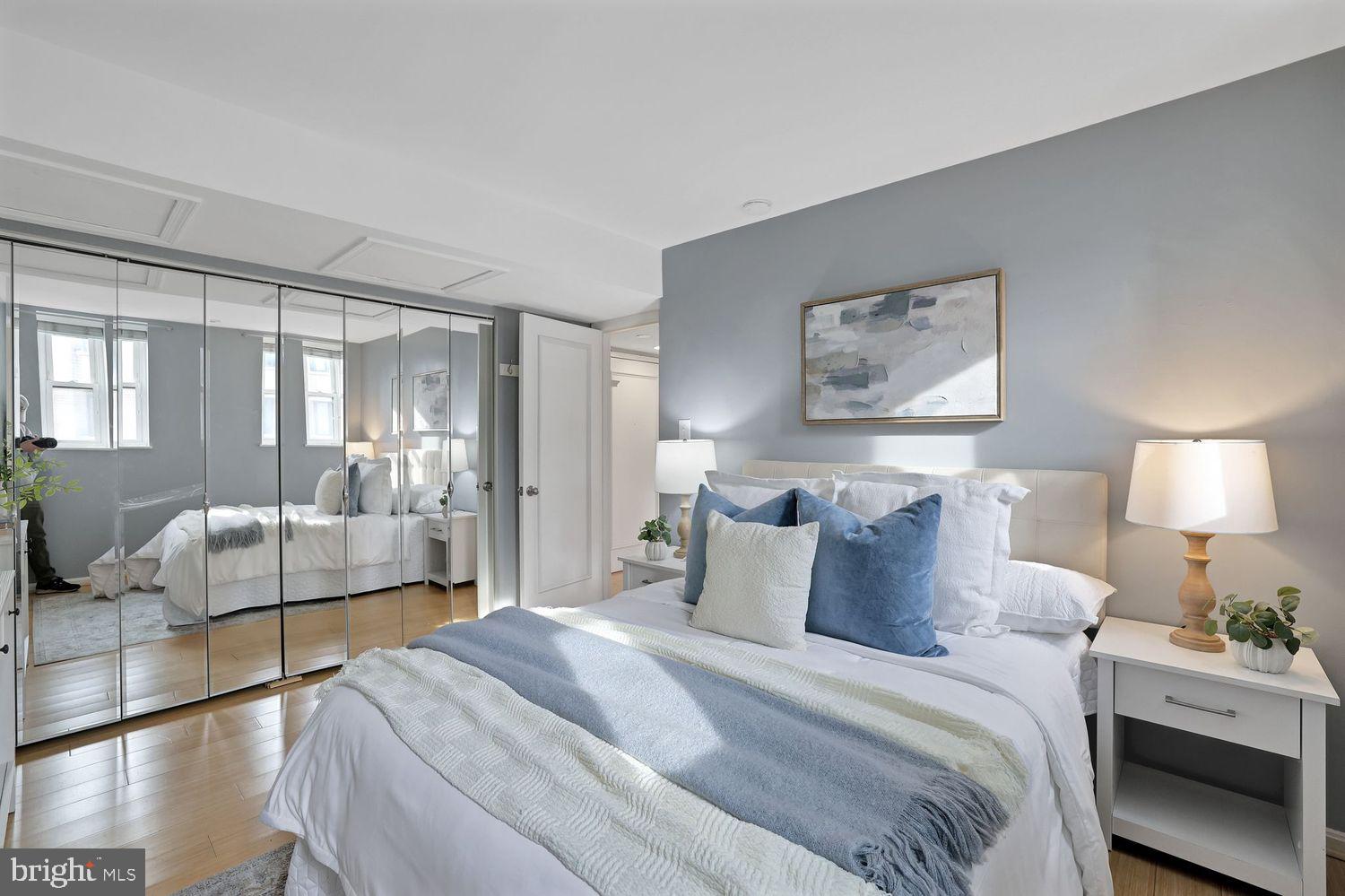 1133 13th Street Northwest, Unit 704 Washington, DC 20005 - Photo 15 of 23 a bedroom with a bed and a large mirror