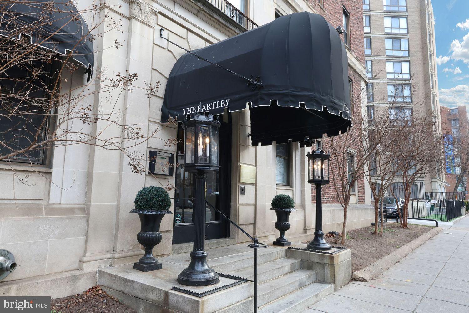 1133 13th Street Northwest, Unit 704 Washington, DC 20005 - Photo 22 of 23 a front view of a building with sitting area