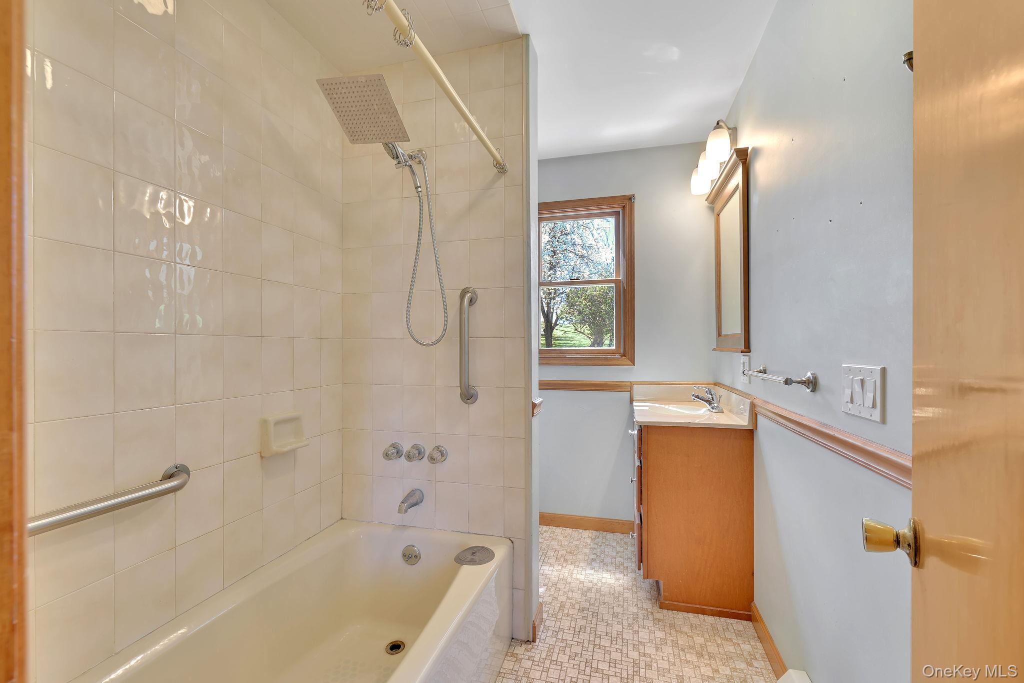 208 Shortcut Road Cochecton, NY 12726 - Photo 15 of 46 a bathroom with a tub sink and mirror