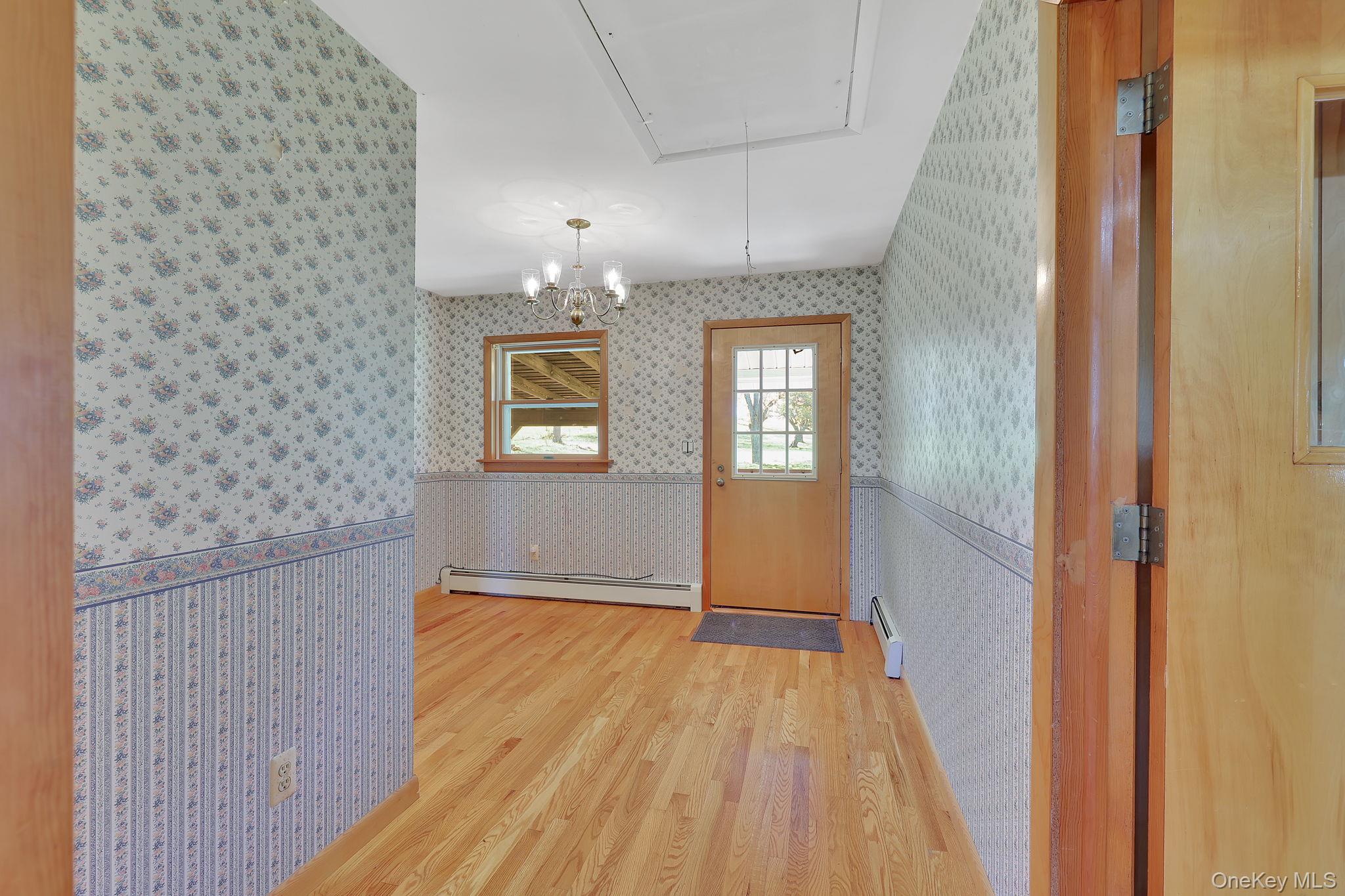 208 Shortcut Road Cochecton, NY 12726 - Photo 16 of 46 a view of livingroom with hardwood floor and hallway