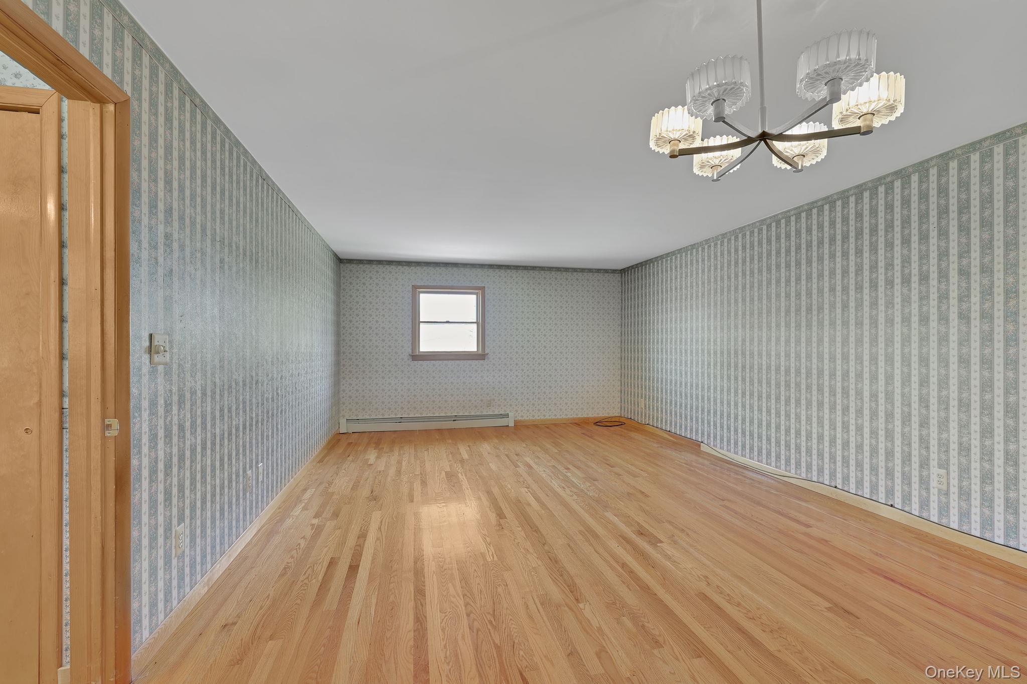 208 Shortcut Road Cochecton, NY 12726 - Photo 18 of 46 a view of empty room with wooden floor and fan