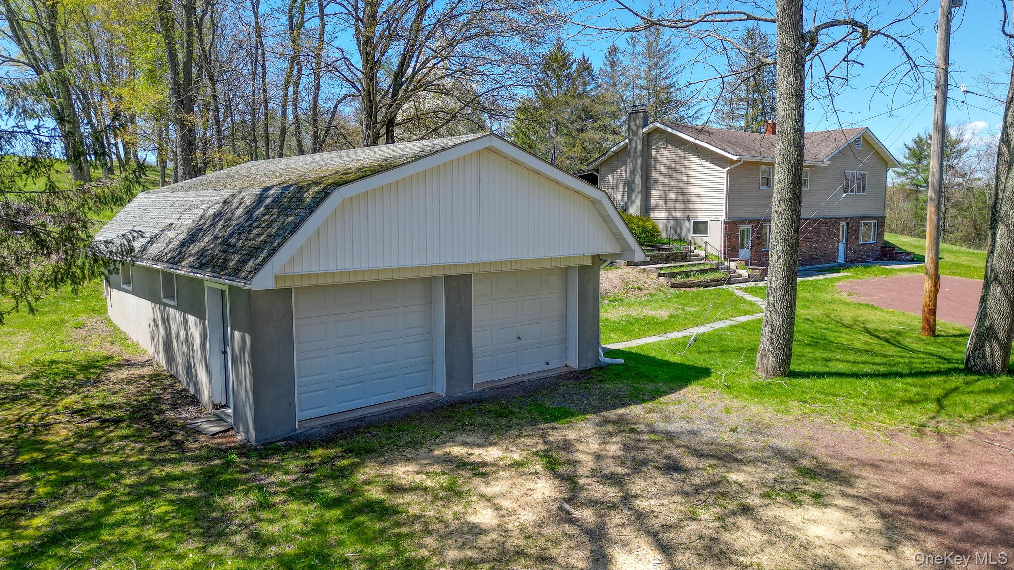 208 Shortcut Road Cochecton, NY 12726 - Photo 4 of 46 a view of a house with a yard and pathway